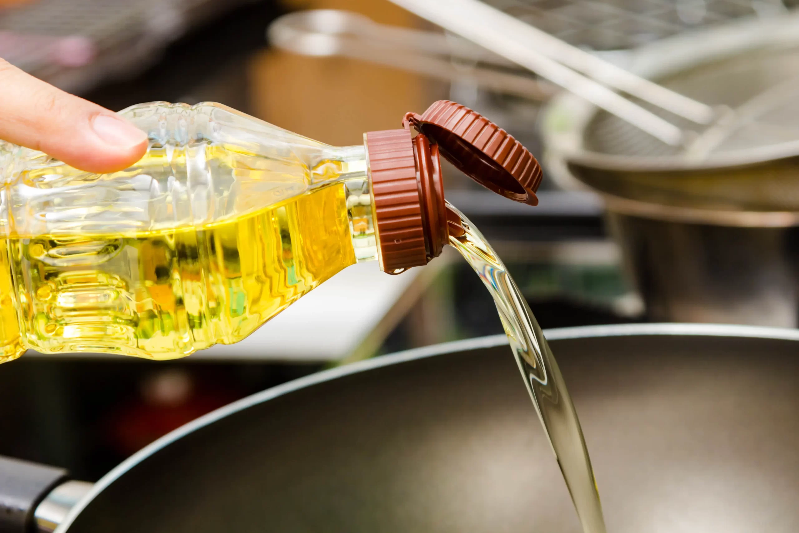 Pouring Vegetable Oil in a Pan